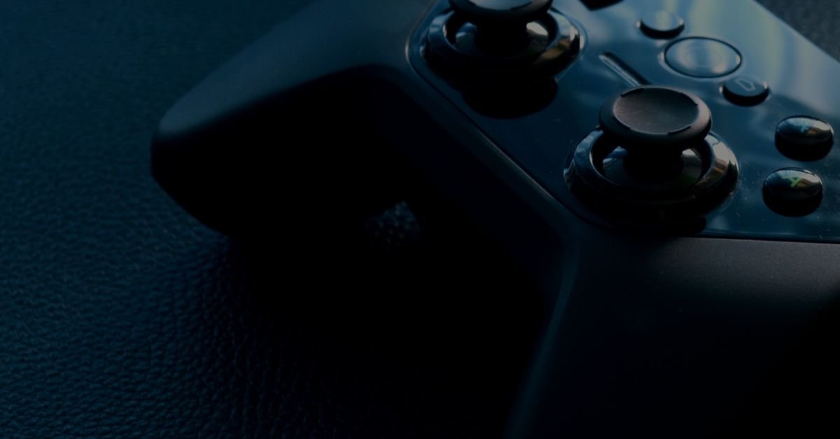 Black video game controller representing Web3 gaming and play-to-earn NFTs