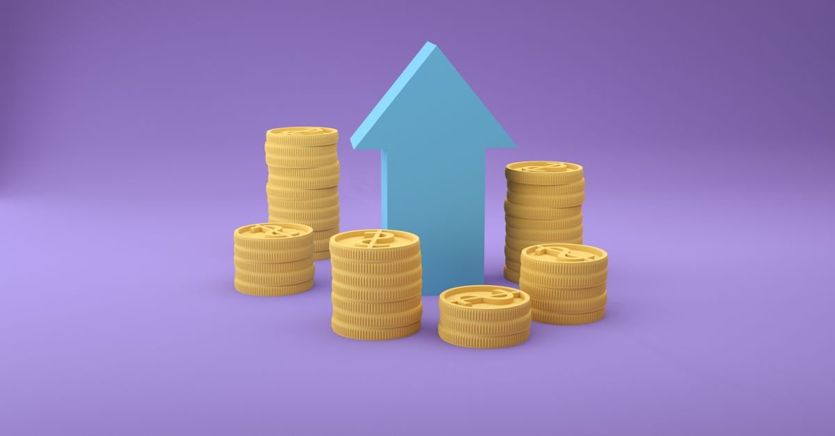 Stacks of coins with an upward arrow representing cryptocurrency growth