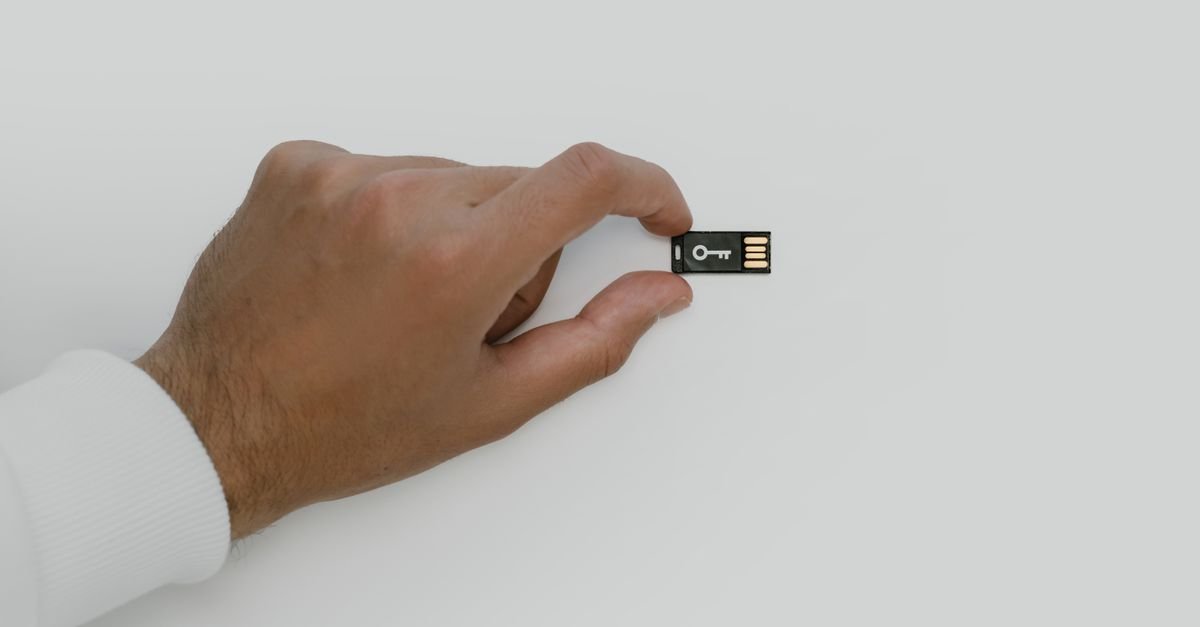 USB security key device representing hardware crypto wallets like Ledger and Trezor